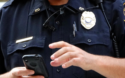 Police Officer Checking Digital Auto Insurance